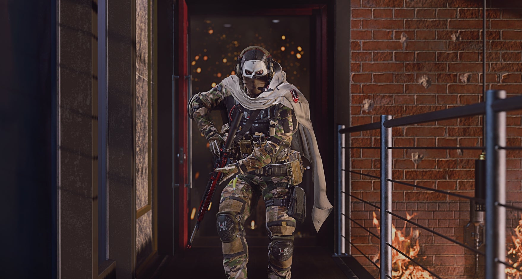 A soldier wearing a jaunty cape walks towards the camera on a platform underneath which the tops of flames are visible in Call Of Duty: Modern Warfare 2.