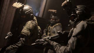 A Call of Duty: Modern Warfare screenshot showing three heavily armed and armoured soldiers.