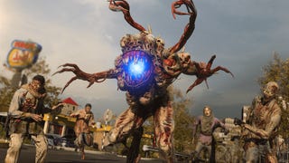 A screenshot from Call of Duty: Modern Warfare 3's Zombies mode showing a hulking creature with tendril-like appendages and a glowing blue 'eye' surrounded by zombies.