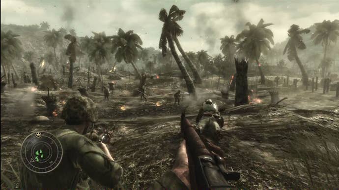 Soliders storm a battlefield - littered with mud and palm trees - in the Pacific theatre in Call of Duty: World at War.