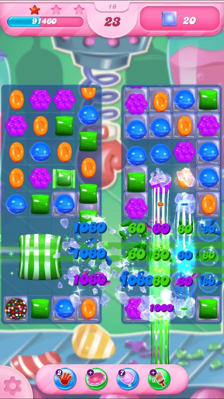 Candy Crush screenshot mid-match. An 8x9 grid of candies of various colors are shown, with a number of effects happening on the bottom half of the screen as various candies are matched.
