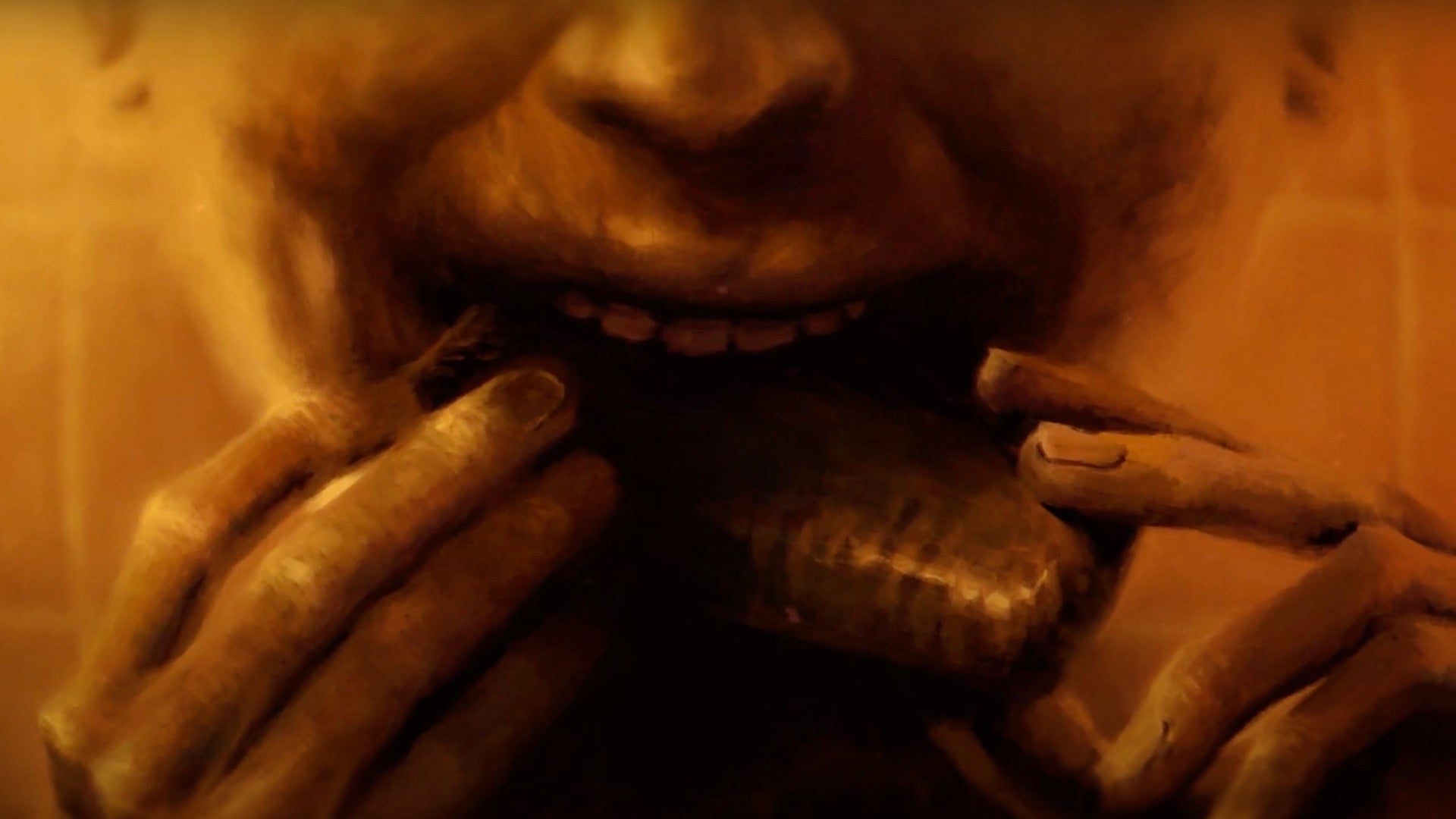 An illustrated close-up of a bloodied mouth gnawing on a chunk of (presumably human) meat.