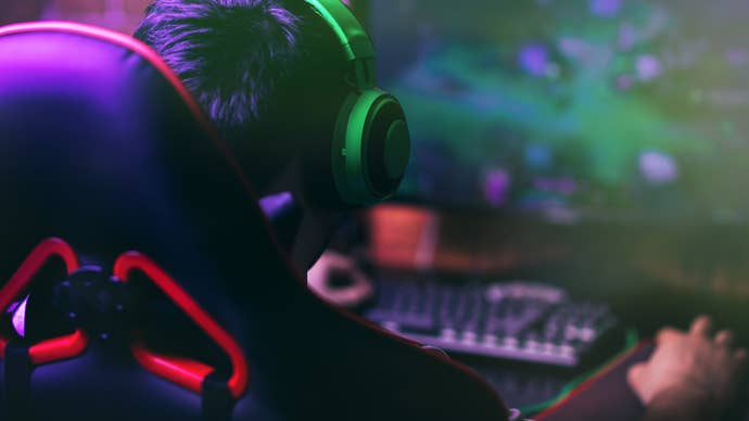 A child gaming at a PC