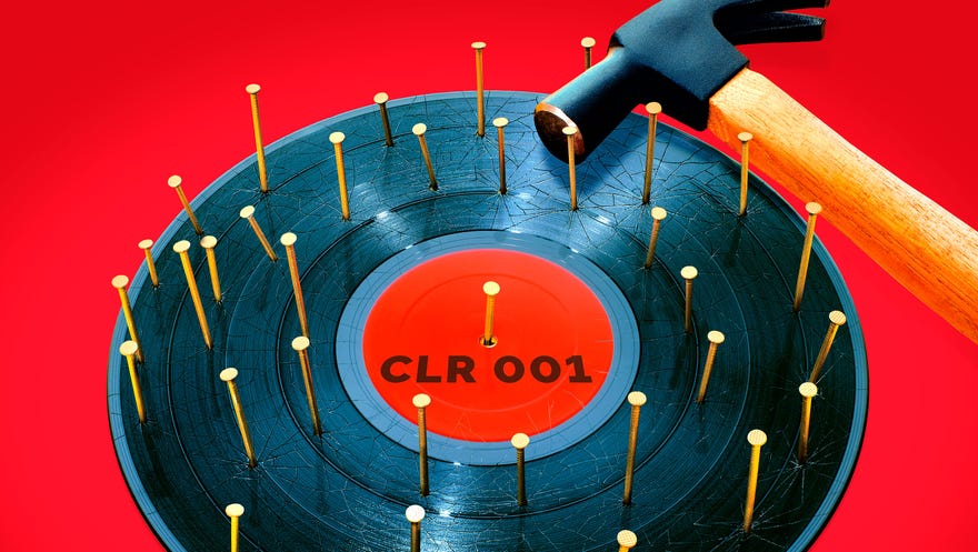 CircoLoco Records - Monday Dreamin' album artwork: A record labeled “CLR 001” with a bunch of nails through it and a hammer laying on its side on top.
