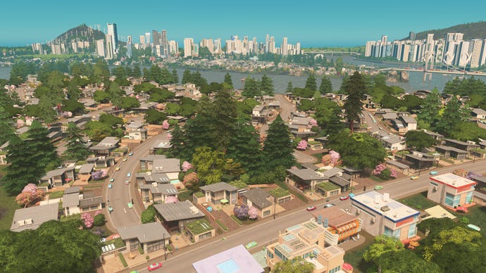 A beautiful curving road with houses neatly aligned in a Cities: Skylines screenshot.