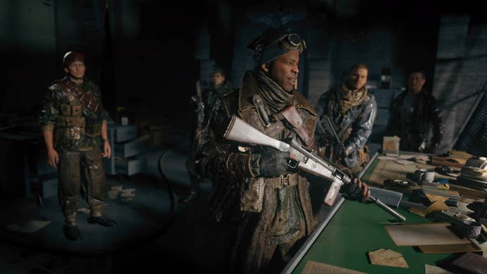 A group of soldiers smile over a table in Call Of Duty Vanguard