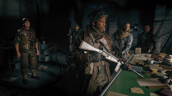 A group of soldiers smile over a table in Call Of Duty Vanguard