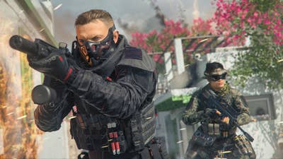 Call of Duty: Modern Warfare 3 screen showing a man and a woman in high-tech equipment holding guns