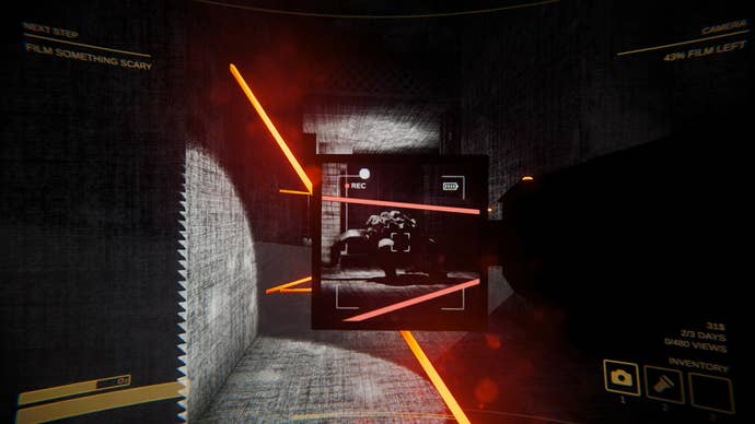 A player aiming a video camera with a pop-out screen at a monster in a corridor lit by laser beams
