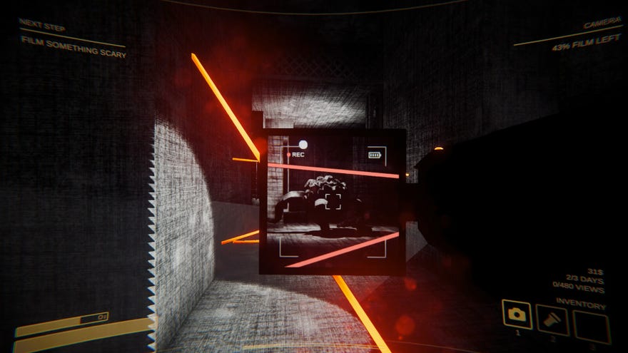 A player aiming a video camera with a pop-out screen at a monster in a corridor lit by laser beams