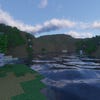 A screenshot of a river in Minecraft, with some trees on either side of the bank and a hill in the distance, taken using Continuum shaders.