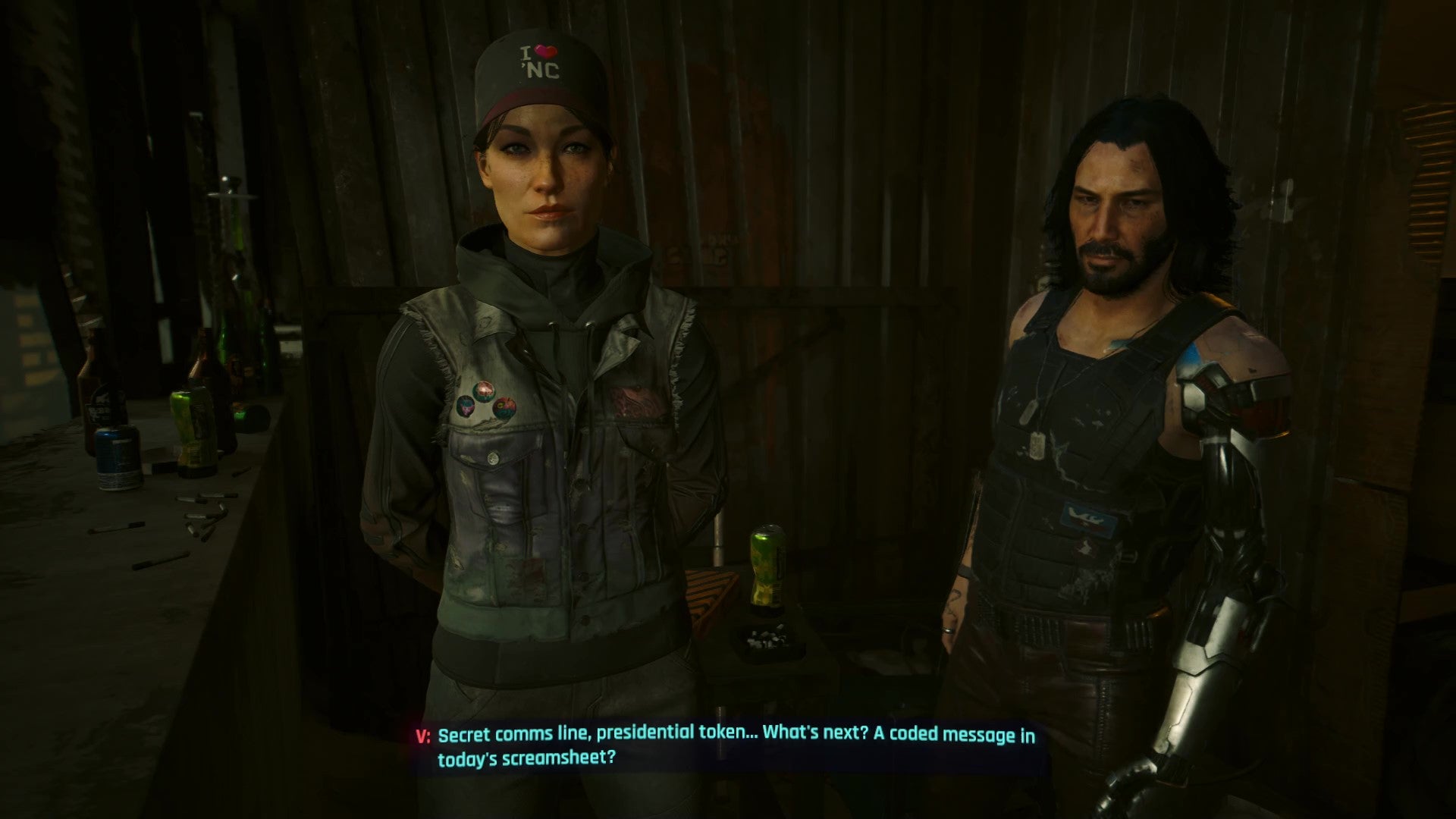 Myers and Johnny face V on the Dogtown hideout balcony as they discuss the benefits and drawbacks of taking the presidential oath.