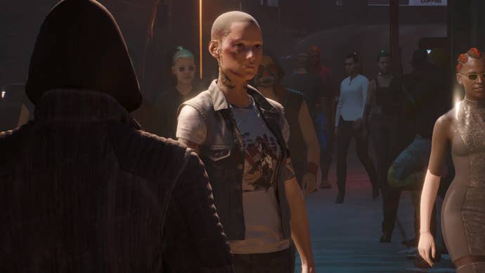 V, with a shaved head and stripped of her cyberware, stands anonymous amid a Night  City crowd in The Tower ending final cutscene.