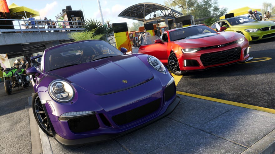 A purple Porsche sits next to a red Chevrolet and a yellow BMW in The Crew 2.