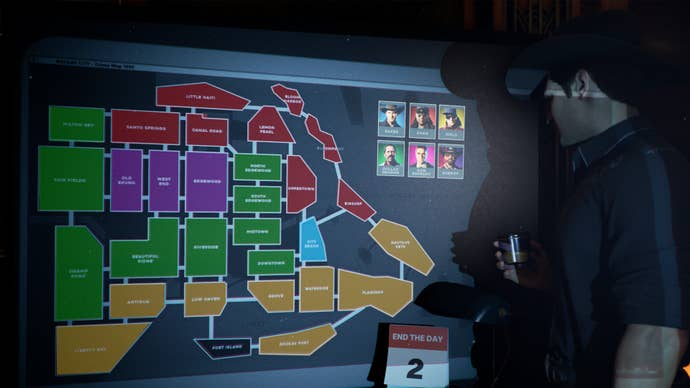 A screenshot from Crime Boss: Rockay City which shoes Michael Madsen looking at a map of Rockay City’s various territories, which are all colour-coded according to gang affiliation.