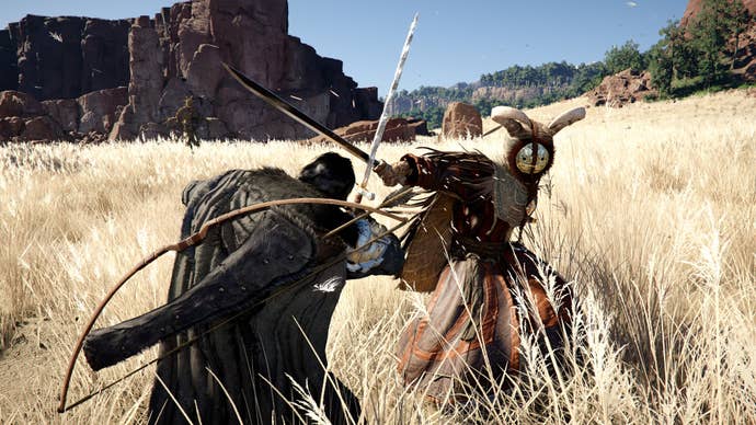 Two medieval warriors battle it out in a field.