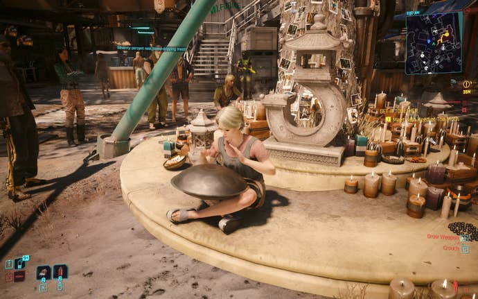 A lady playing a steel drum by a memorial tree in Cyberpunk 2077: Phantom Liberty.