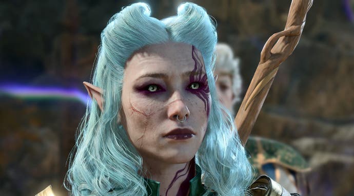An femine elven character in Baldur's Gate 3, with pale blue hair, scarred face and a purple tattoo whisping out like smoke from her eye, looks up at the camera with a forlorn expression.