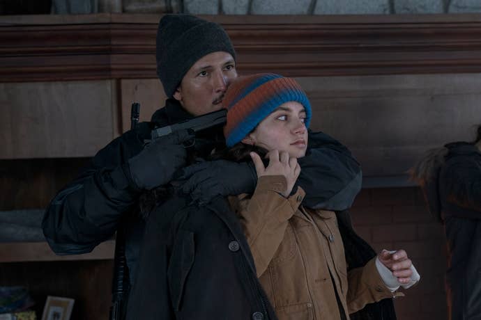 Dina is held at gun point by Manny in TLOU season two