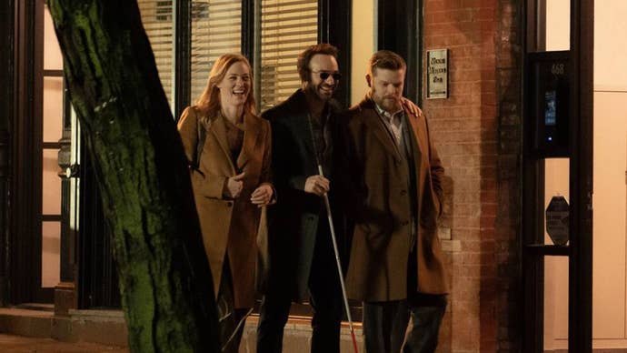 Karen Page, Matt Murdock, and Foggy Nelson walking along laughing together on a New York street in Daredevil: Born Again.