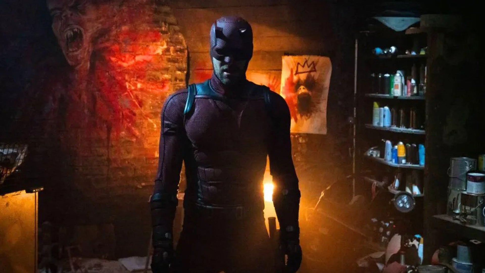 Daredevil is stood, mouth open, in a run down room with art materials and strange art pieces seen in it in Daredevil Born Again.