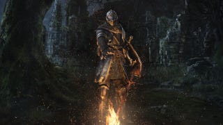 The Chosen Undead stands before a bonfire in Dark Souls Remastered artwork.