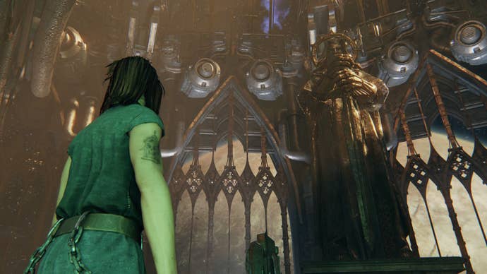 Looking up at a huge golden statue of the Emperor in Warhammer 40K Darktide