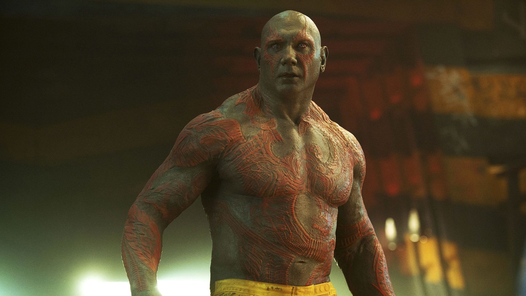 Dave Bautista as Drax is stood shirtless in a prison, wearing only prison trousers. - 1