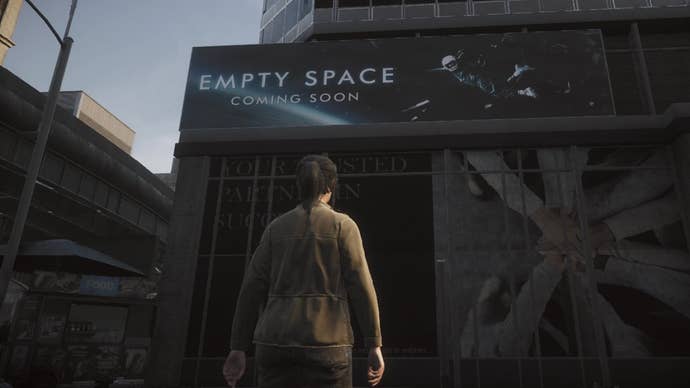 A survivor stands in front of a billboard for a film called “Empty Space” with the tagline “coming soon” in The Day Before.