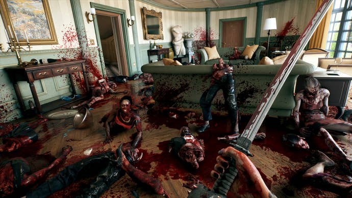 The player stands in a lounge area full of slaughtered zombies while wielding a katana in Dead Island 2