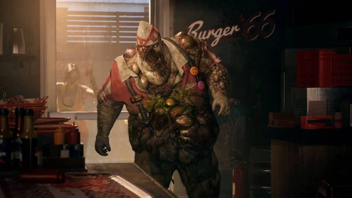 A bloated zombie from Dead Island 2, covered in what seem to be pustules, stands in the back of a burger restaurant, still wearing part of the uniform