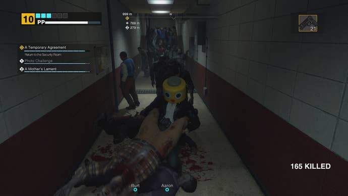 Frank spins a zombie around by its feet in Dead Rising Deluxe Remaster.