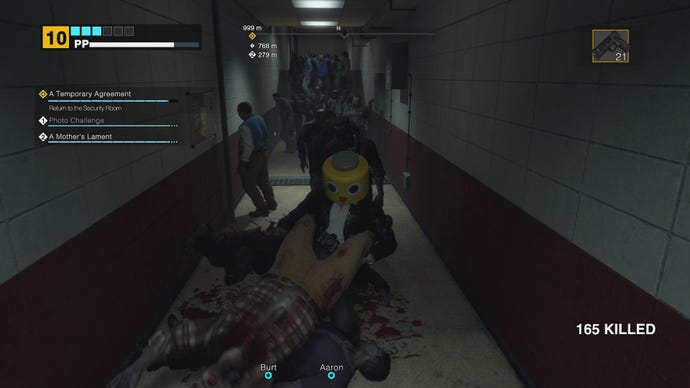 Frank spins a zombie around by its feet in Dead Rising Deluxe Remaster.