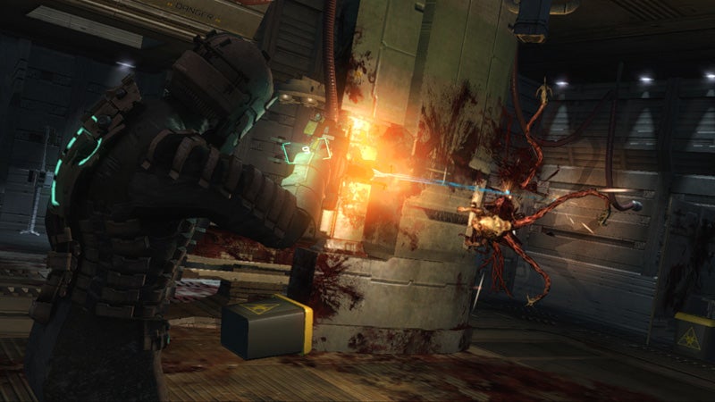 Isaac Clarke shoots an enemy using his Plasma Cutter in Dead Space - 15