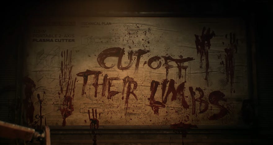 A still from the Dead Space remake reveal trailer, showing the words “Cut off their limbs” scrawled on a wall in blood by a person who presumably had lost their pen.