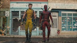 Wolverine n' Deadpool is hustlin along a street, buildings behind dem slightly fucked wit, Wolverine's suit damaged up in Deadpool & Wolverine.