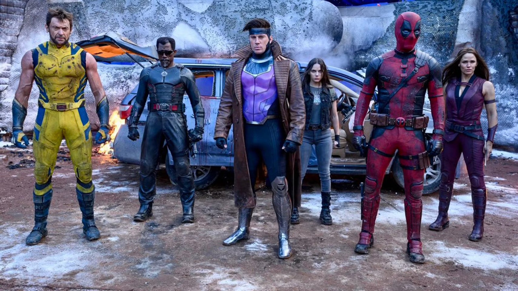 From left to right: Wolverine, Blade, Gambit, X23, Deadpool, and Elektra, in Deadpool & Wolverine. They are all stood in a row looking at something offscreen. - 1