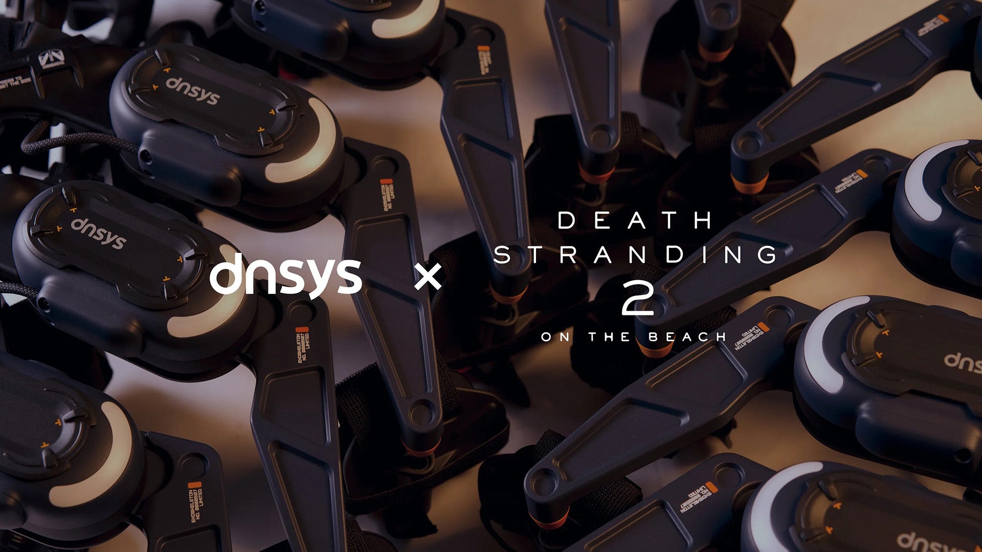 The logos for Dnsys and Death Stranding 2 superimposed over a number of Death Stranding 2 themed exoskeletons. - 1