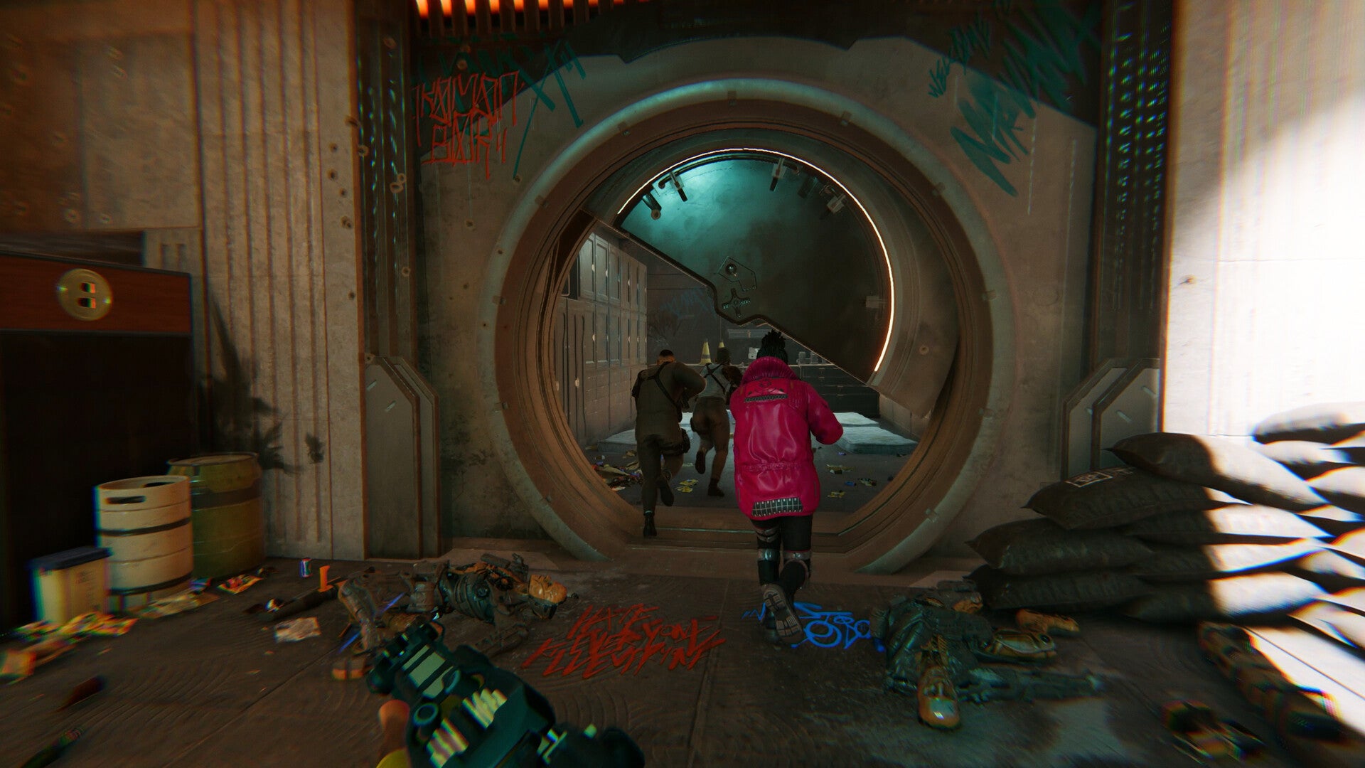 Three men clad in futuristic clothes run into a vault in Den of Wolves. There is debris and graffiti around them. - 3