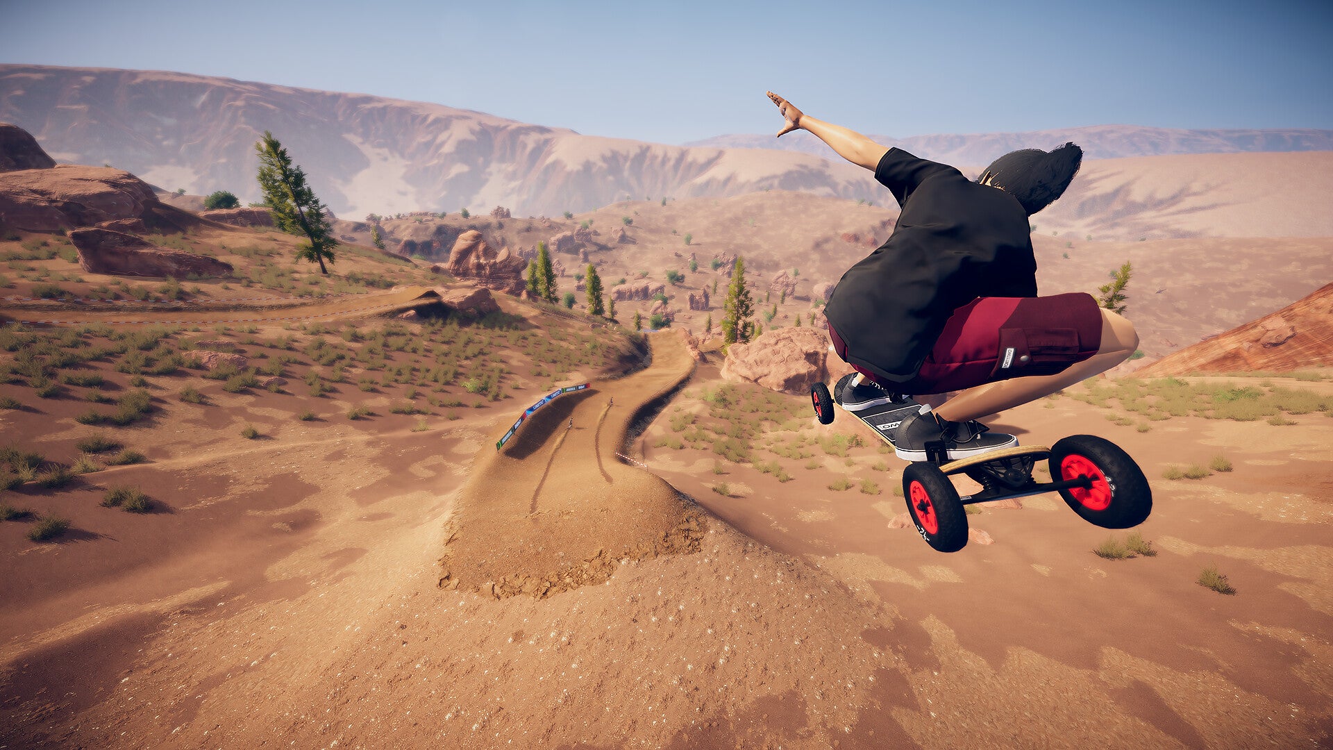 A Descenders Next screenshot showing a mountain boarder riding down a desert-like hill.