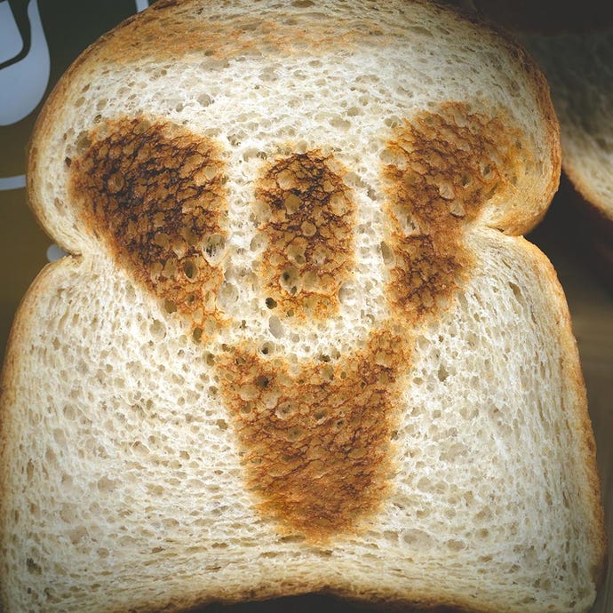 The Destiny logo toasted into bread by Destiny 2's long-awaited official toaster.