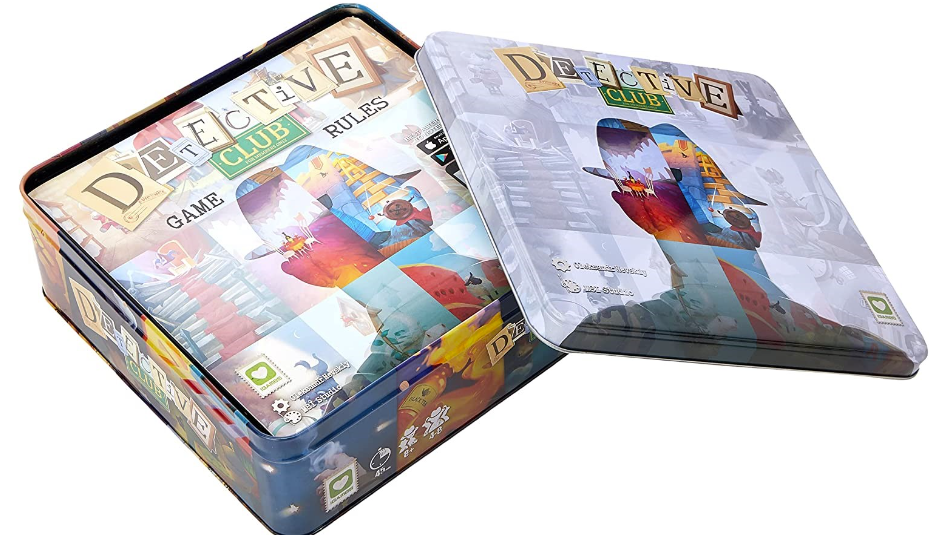 A product shot of the Detective Club board game, which comes in a large tin. The lid is slid off to reveal the top of the contents in the box. You can&rsquo;t see much of it beyond the game&rsquo;s artwork, which is a silhouetted figure wearing a hat - a detective&rsquo;s hat.