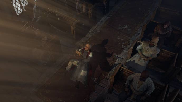 A scene in Diablo 4’s open beta showing a priest kneeling in a ray of light in a church, looking troubled