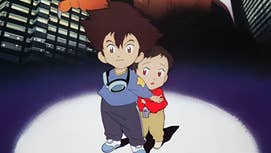Two young siblings, Taichi and Hikari, stand in a spotlight, a giant Digimon behind them cropped out.