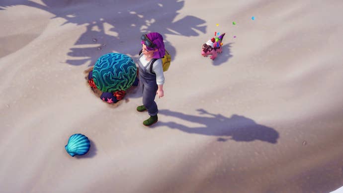 Disney Dreamlight Valley, character is looking down a blue scallop on the beach