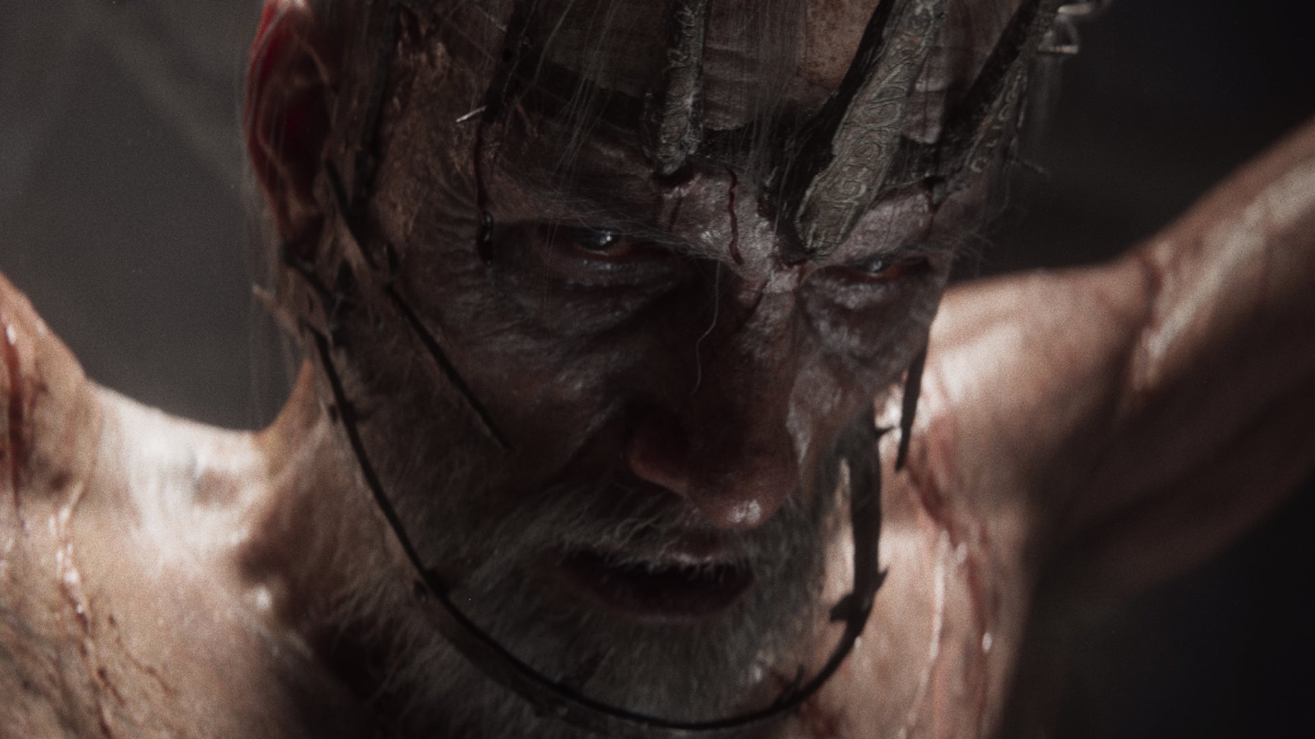 A naked, strung-up man in close-up from the new Divinity RPG. - 1