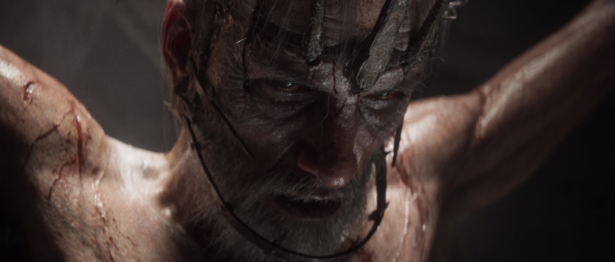 A naked, strung-up man in close-up from the new Divinity RPG. - 11