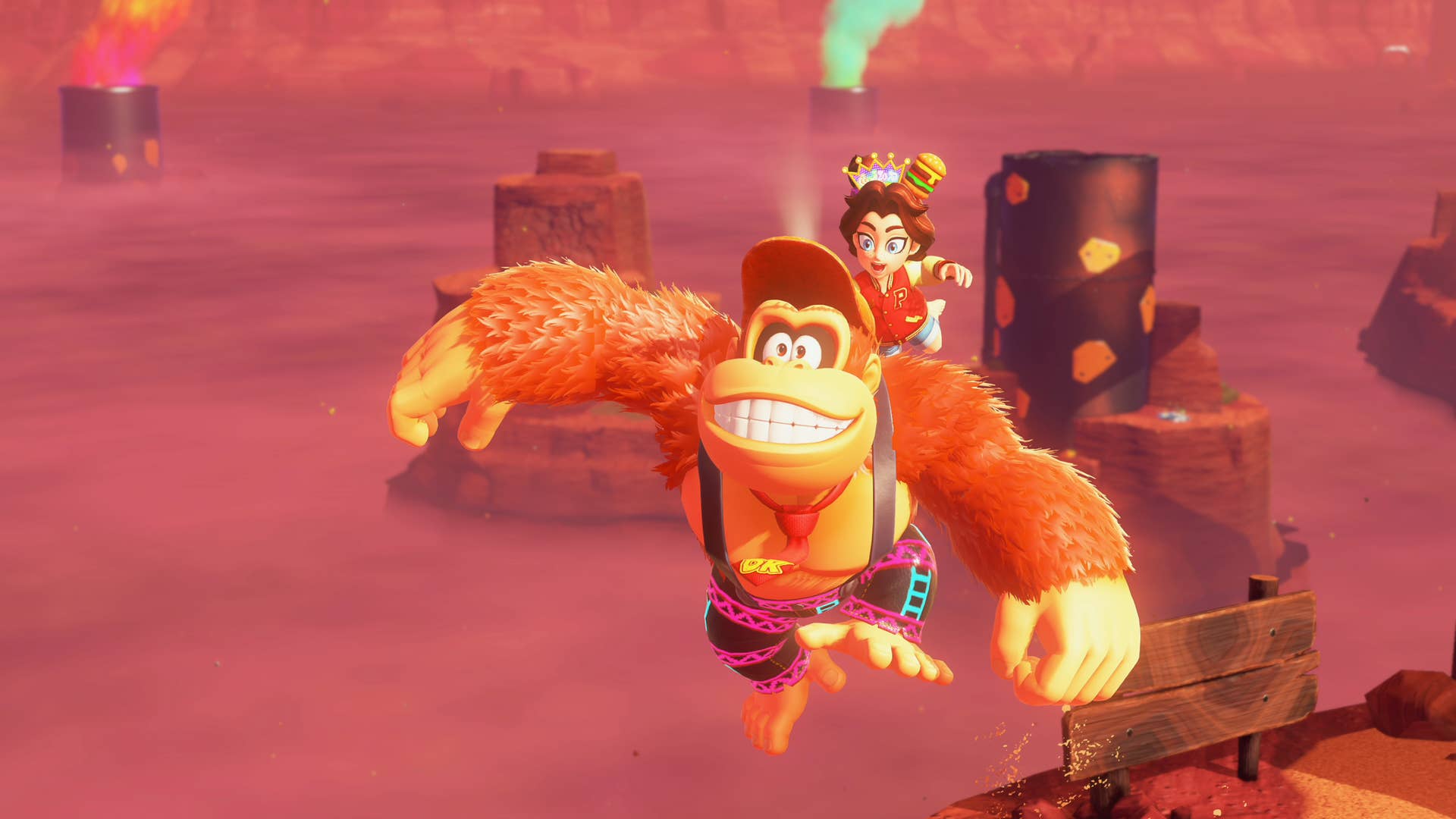Donkey Kong and Pauline grin, mid jump through a ruddy mine environment, in this Donkey Kong Bananza screenshot.