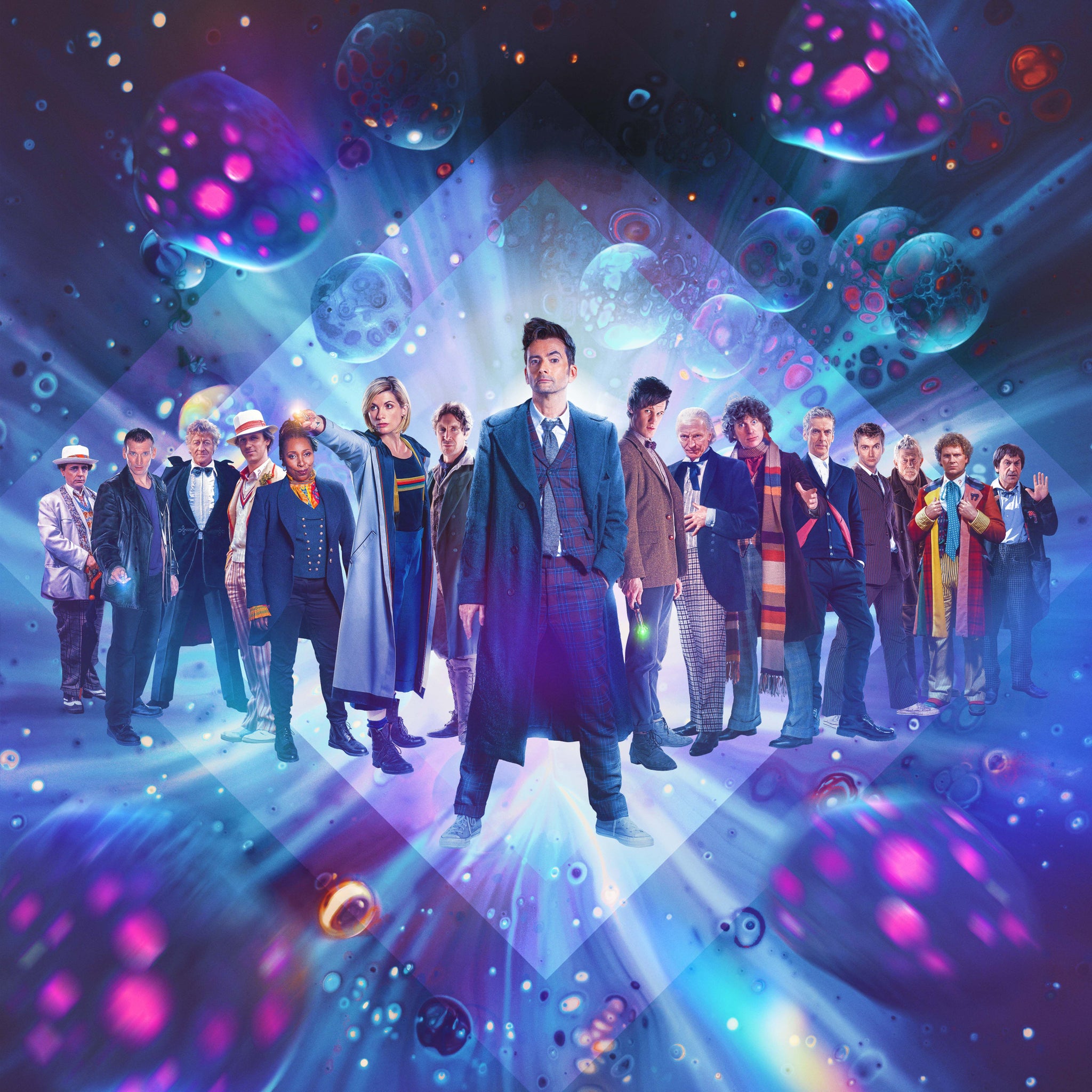 All 14 Doctor Whos stand in a line, with David Tennant in the middle, but also appearing as his younger self to the right of the lineup. - 4