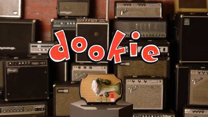 The title for the Green Day album Dookie above a Big Mouth Billie Bass, with a bunch of amps behind it.
